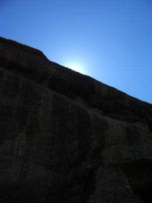Sun just beyond the cliff
