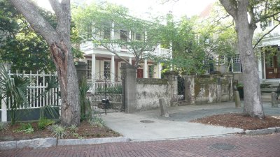 in front of a beautiful old home on a back street.