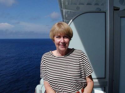 Judy on our balcony of stateroom B209