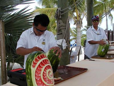 Fruit carving artists demostrate their talent.