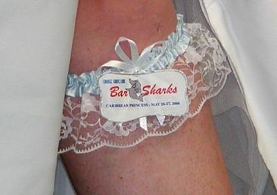 Bre displays her custom-made Bar Sharks wedding garter.