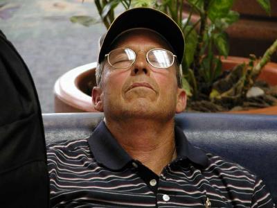 Buddy catches a nap in the airport after a hard week of cruise partying.