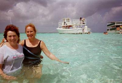 Sisters, Shelley and Phyllis wade at Stingray Sandbar.