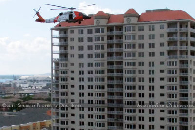 2011 - Coast Guard MH-60J #CG-6036 on a port and harbor patrol just south of downtown Tampa aviation stock photo