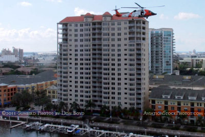 2011 - Coast Guard MH-60J #CG-6036 on a port and harbor patrol just south of downtown Tampa aviation stock photo