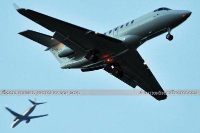 XO Jets Bombardier Challenger 300 CL-30 N541XJ on approach to OPF as AA B737-823 N836NN passes by aviation stock photo