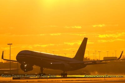 2010 - American Airlines B757 landing on runway 8R at MIA sunset aviation stock photo