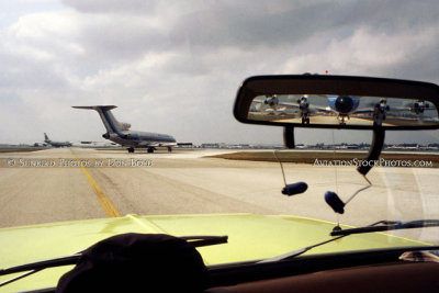Early 1980's - a Pan Am B747, an Eastern B727 and unknown Lockheed L-188 Electra in the rear view mirror