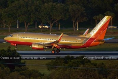 2012 - Southwest Airlines B737-7H4 N792SW in the Retro Gold scheme on approach to 1L at TPA airline aviation stock photo