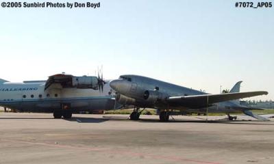 Avialeasing An-12BP UK-11418 next to damaged right wing of Florida Air Cargo's DC3-S1C3G N123DZ aviation stock photo #7072