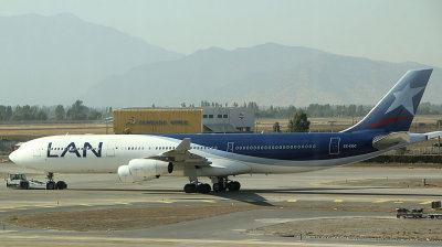 LAN A-340 being towed to its gate in SCL, Dec 2011