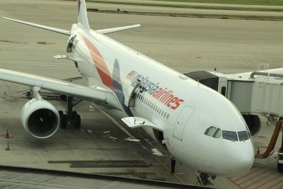 Malaysian Airlines A-330 in the new livery at its gate in PVG
