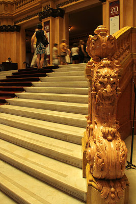 Grand stairs and sculpture inside Teatro Colon