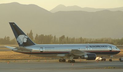 AeroMexico B-767-200 waiting to be towed to its gate at SCL