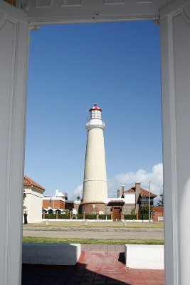Punta lighthouse through church door