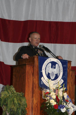 Brigadier General Larry Nicholson, an AMAr, addresses the audience.