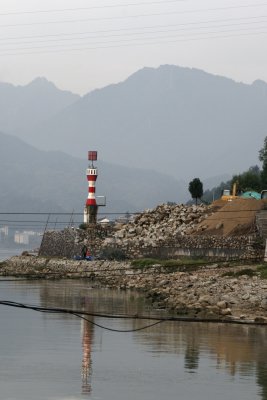 Mountains and a beacon near the dam