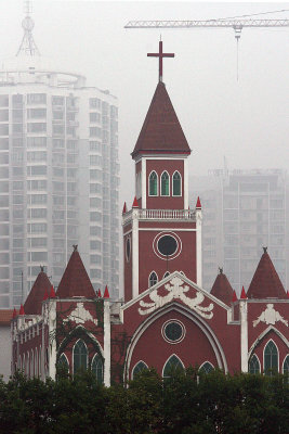 Along the river - condos, the national bird of China (the crane - steel, not feather) and a beautiful church.