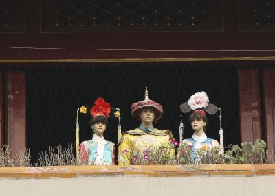 Fake people on the balcony in Forbidden City