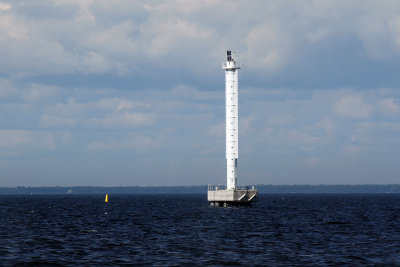 Lighthouse in middle of water on way from Peterhof to Hermitage on hydrofoil