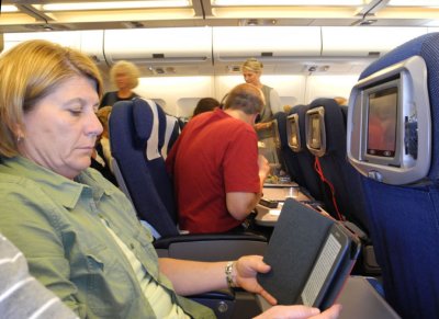 Brenda reading her Kindle on the 8 hour flight