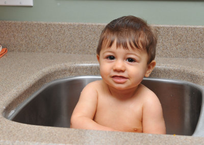Bath Time in the Kitchen Sink at Grandmas