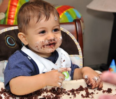 Birthday Boy proud that he destoyed his cake.