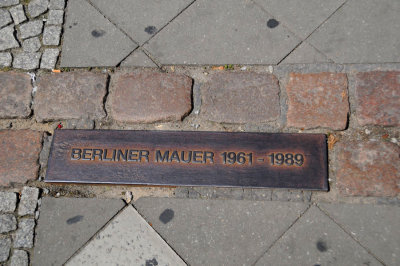 Marking in sidewalk depicts location of the Berlin Wall