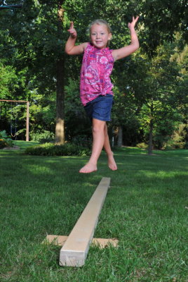 Macey leaping on the balance beam