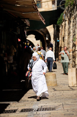 Old woman walking through Muslim Quarter