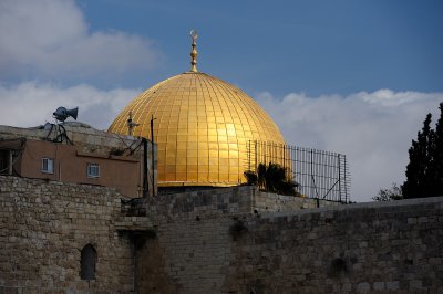 Sunlight hits Dome of the Rock over Western Wall
