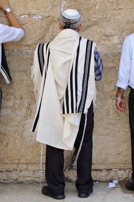 Jewish religious man praying at Western Wall