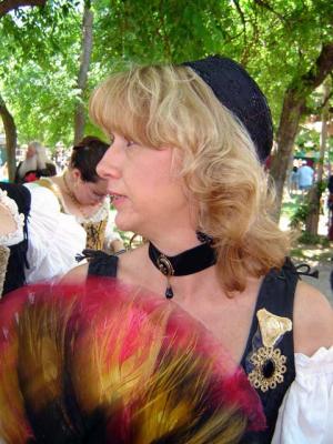 Cin fans herself on a warm day