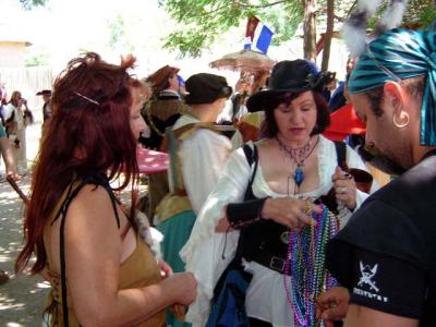 Mariposa, Hurricane checking out Troy's beads.