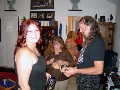 Midian grins while Rev shows Scorn the Ankle restraints