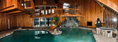 This home, built of slate blocks, is finished inside with exotic woods, and masterful craftsmanship.
An unfinished waterfall is in the right corner.