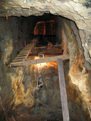 Looking up at a 45 degree angle up a mine shaft.