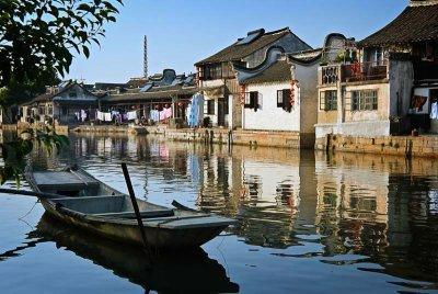 Water lane, boat, & charming houses