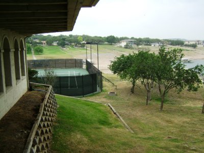 Tennis courts that are at one end of the property.
