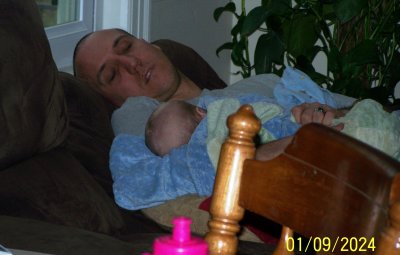 Dad fell asleep holding his son while the rest of us were primarily in the kitchen, getting a meal put together.  It was one of those Kodak moments for me.