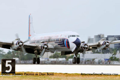 The Historical Flight Foundation's restored Eastern Air Lines DC-7B N836D touching down at MIA aviation stock photo