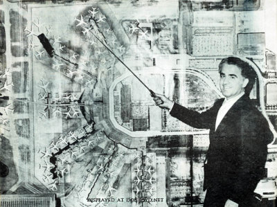 Early 1970s - Aviation Director Dick Judy in front of an aerial future growth photo of Miami International Airport