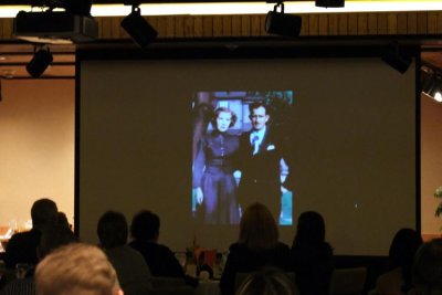 Guests watching the Dick Judy family's video of old photos during the Dick Judy Celebration of Life luncheon