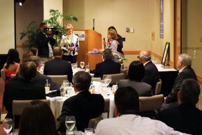 Sonja R. Judy speaking to the guests at the Richard H. Dick Judy Celebration of Life luncheon at MIA
