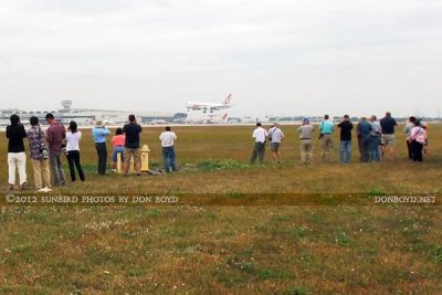 2012 MIA Airfield Tour - bus #2 tour group with ATI B767 landing on runway 30 in the background