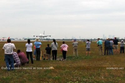 2012 MIA Airfield Tour - bus #2 tour group with the Lufthansa A380 about to touch down on runway 27 in the background