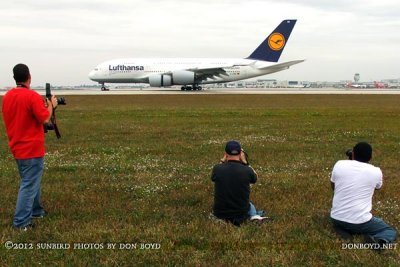 2012 MIA Airfield Tour - some photogs from bus #2 tour group with the Lufthansa A380 landing on runway 27 in the background