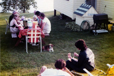 Early 1970's - John M. Boyd (left, brown jacket) having dinner outside at the Henderson's on Upper Rideau Lake, Ontario, Canada