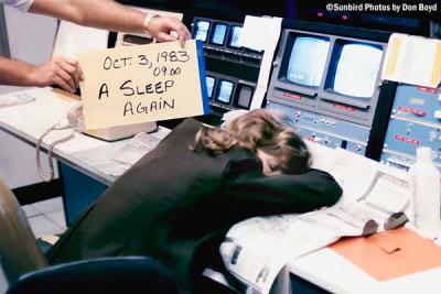 1983 - Sleeping Airport Attendant, spelling and sign held by Lonny Craven