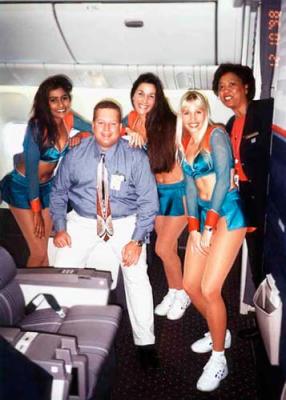 1998 - Lonny Craven getting down with the Miami Dolphin Cheerleaders onboard inflight United B777